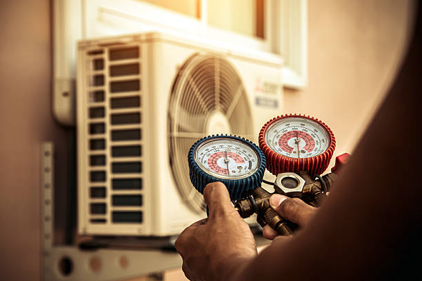 Professional Air Conditioning Service technician working in Forestdale, AL